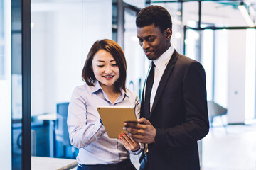 Businesspeople using tablet in office