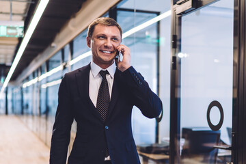 Businessman talking on phone in office