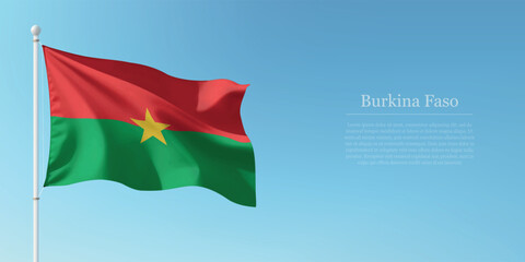 Waving Flag of Burkina Faso Against Clear Blue Sky Copyspace