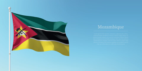 Waving Flag of Mozambique Against Clear Blue Sky Copyspace