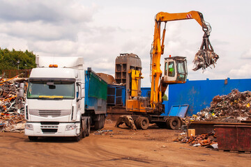 Scrap steel being loaded into a truck after being cut up in shear