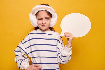 Confused schoolgirl with thought bubble blank text space winking and frowning while informing about...
