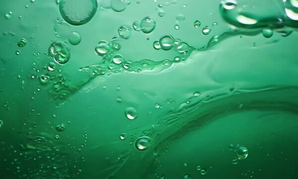 Abstract background of green liquid with bubbles forming on its surface, creating a mesmerizing and visually appealing pattern