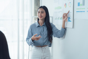 Confident Presentation: A professional woman gives a compelling presentation, showcasing her expertise and engaging her audience with data-driven insights.  