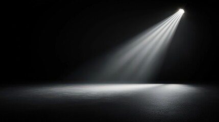 A dark room with a spotlight shining on the floor