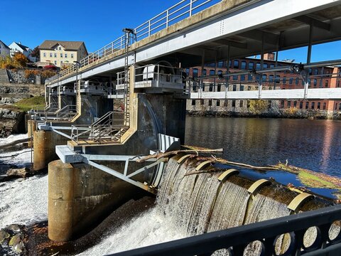 New England Thundermist Water Rapids Hydro-Engineering Turbulence Falls Dam on Blackstone River in Downtown Woonsocket, Providence Rhode Island RI, USA. Historical Glenark Mills Building in Background