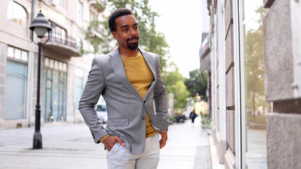 African American elegant man exploring shops in the city