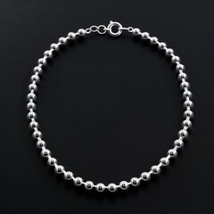 Rhodium plated sterling silver bead chain simple and chic on plain black dark background