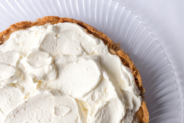 Banoffee banana pie with caramel sauce and cheese cream on the white background. Traditional english cake. Ready to eat. Cooking concept