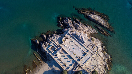 Landscape view of Kastri Island from the Ruins of the Basilica St. Stefanos at Agios Stefanos Beach...