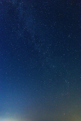 Fototapeta premium She County, Anhui Province - The Milky Way in the night sky against the backdrop of the mountains