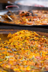 Delicious street food: tender chicken, fragrant curry, and fresh green beans and fluffy rice cooked on the spot. A perfect balance of flavors, delicious meal of farmer's market.
