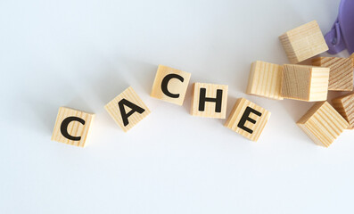 Word CACHE written on wooden cubes on a light background