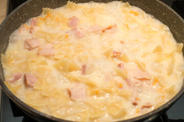 pasta is cooked in bolognese sauce