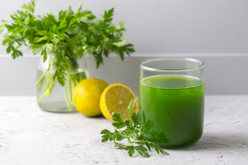 Green healthy detox, lemon and parsley juice. Green vegetable smoothie