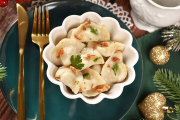 Top view of a bowl of traditional Christmas dumplings with sauerkraut and mushroom filling