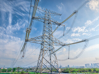 High voltage electricity tower and sky cloudscape