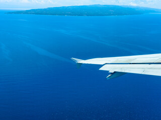 Fototapeta premium Dumaguete, Philippines - Aerial photography of the seascape under the blue sky