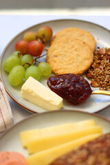 Assortment of various breakfast foods and drinks on the white table. Selective focus.