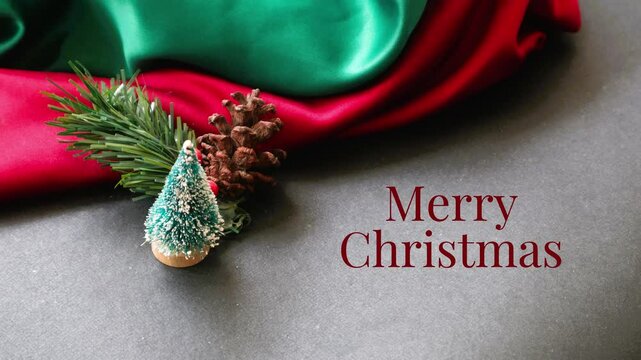 4K video Christmas greeting with pine cones, fir leaves, and a red and green plaid background