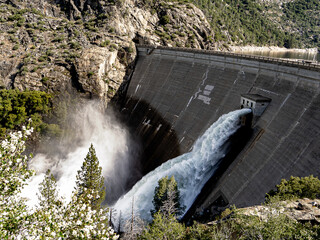 After a record snowmelt, the water discharge at O’Shaughnessy Dam at the Hetch Hetchy Reservoir in Yosemite NP rushes from the 430-foot-high concrete arch-gravity dam. Horizontal