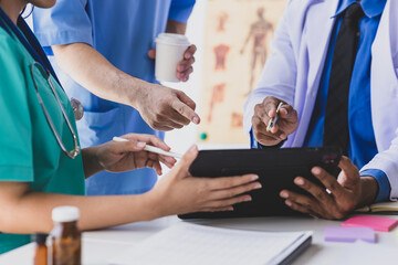 Meeting of doctors and medical personnel in hospitals to discuss research on disease treatment.