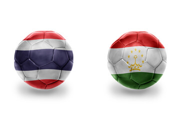 football balls with national flags of tajikistan and thailand , soccer teams. on the white background.