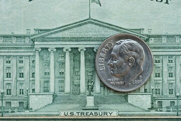 American cent coin on dollar bill close up. United States currency