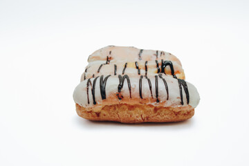 Eclairs glazed. Chocolate eclairs isolated on white background