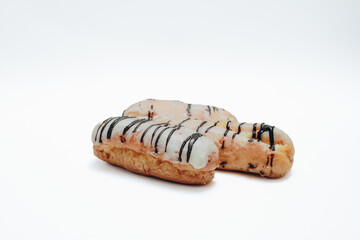 Eclairs glazed. Chocolate eclairs isolated on white background