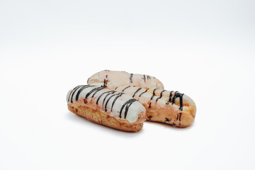 Eclairs glazed. Chocolate eclairs isolated on white background