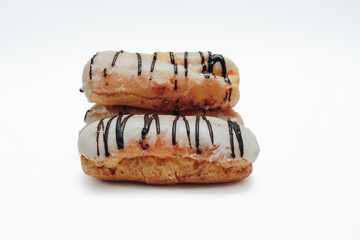 Eclairs glazed. Chocolate eclairs isolated on white background