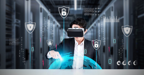 Businessman with goggles working while using security protection. Manager with formal suit checking and accessing at safety system by using augmented technology with data center background. Ingenuity.