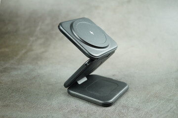 Wireless battery charger isolated on gray background