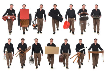 front view of the same man walking carrying various objects from his house, house moving concept