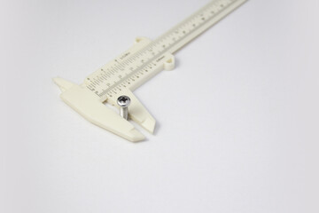 Measuring screw thread diameter with a vernier caliper
