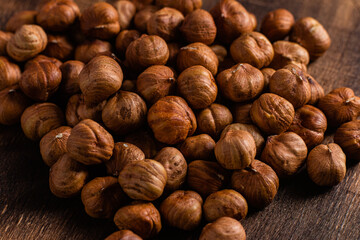 Raw, unshelled hazelnuts close-up. Hazelnut