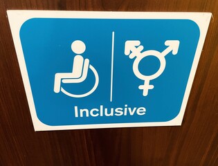 Inclusive signage on toilet door at motorway service station