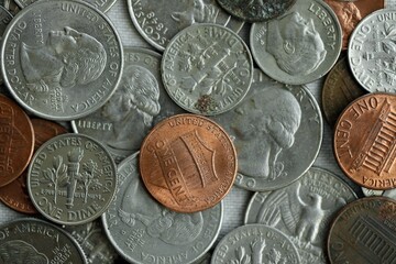 Big pile of United States USD currency silver and bronze coins. American money. Financial and business concept