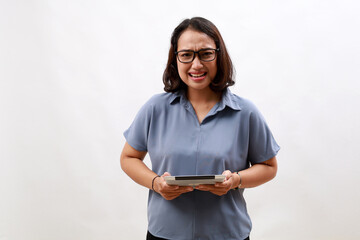 Screaming. Closeup portrait frustrated unhappy young business asian woman employee with tablet...