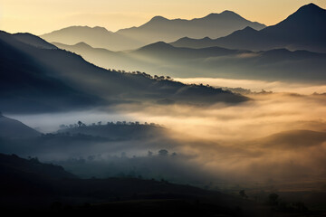 Obraz premium Mystical Sunrise Over Misty Mountain Valleys