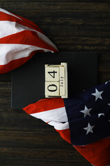 4th of July Celebration with American Flags on Wooden Background