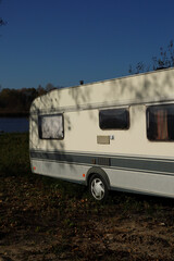 Naklejka premium an abandoned van on the river bank