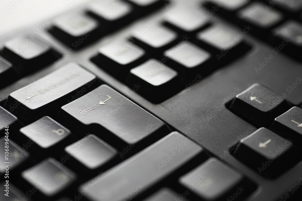 Aufkleber close-up of black computer keyboard with focus on enter key
