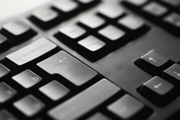 Close-up of Black Computer Keyboard with Focus on Enter Key