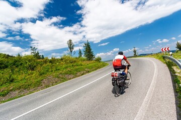 A cyclist riding uphill.