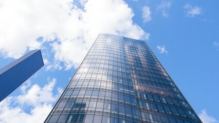Towering Skyscraper Against Blue Sky: Modern Architecture for Office Spaces and Corporate Headquarters
