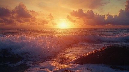 Fototapeta premium A stunning sunrise over the ocean with crashing waves and golden light illuminating the sky.