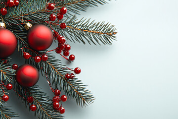 Red balls decoration on green Christmas tree on white background. Winter template, border concept for Christmas, New Year and sale season. Web card and backdrop with space for text