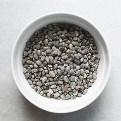 overhead view of blue speckled beans in a white bowl, top view of nigerian army beans, black speckled heirloom beans